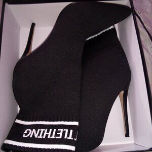 Pretty Little Thing black stretch booties w/ white stripe and name logo